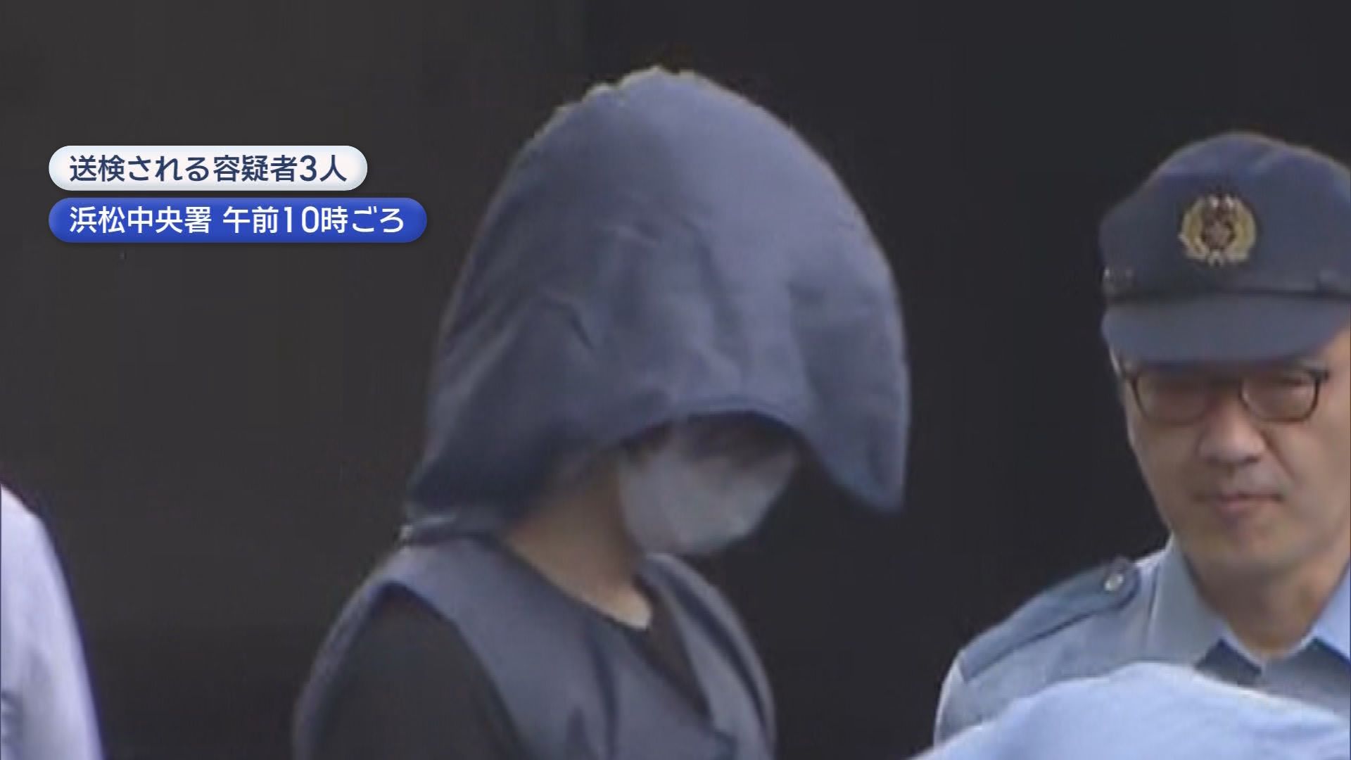 送検される容疑者